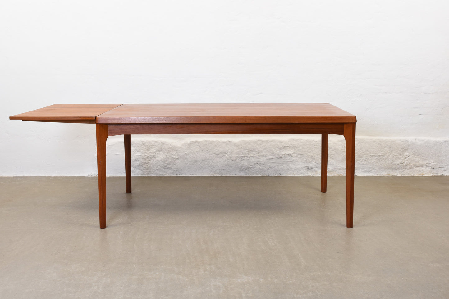 1960s extending dining table in teak by Henning Kjærnulf