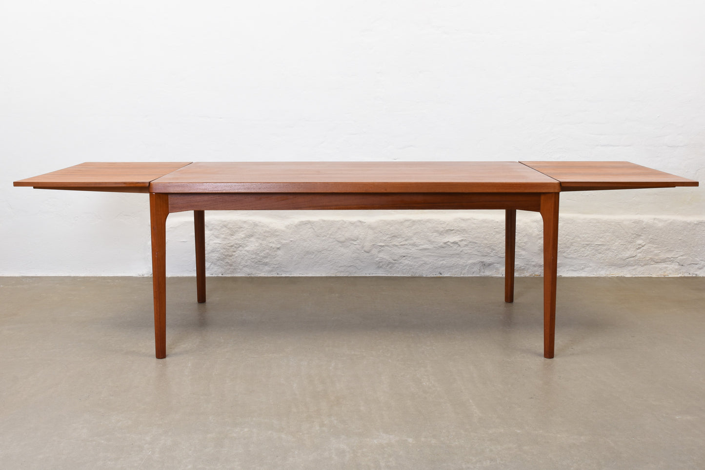 1960s extending dining table in teak by Henning Kjærnulf