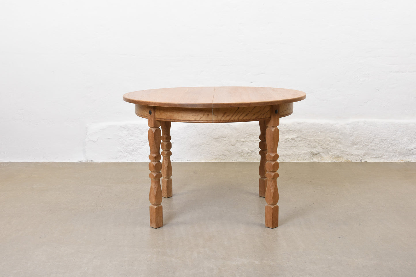 1970s extending oak dining table by Henning Kjærnulf