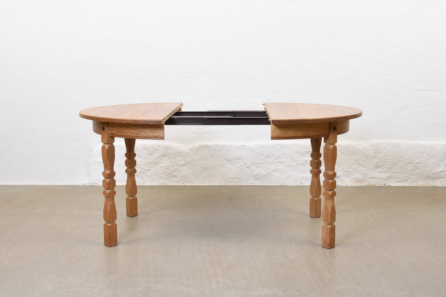 1970s extending oak dining table by Henning Kjærnulf