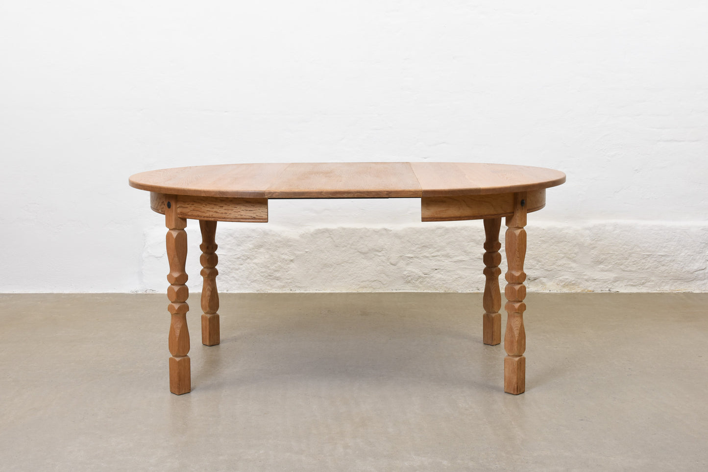 1970s extending oak dining table by Henning Kjærnulf