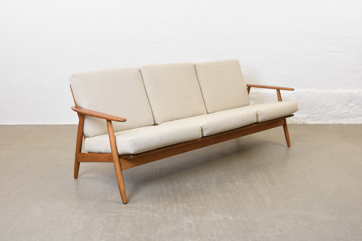 Newly reupholstered: 1960s three seat sofa in beech