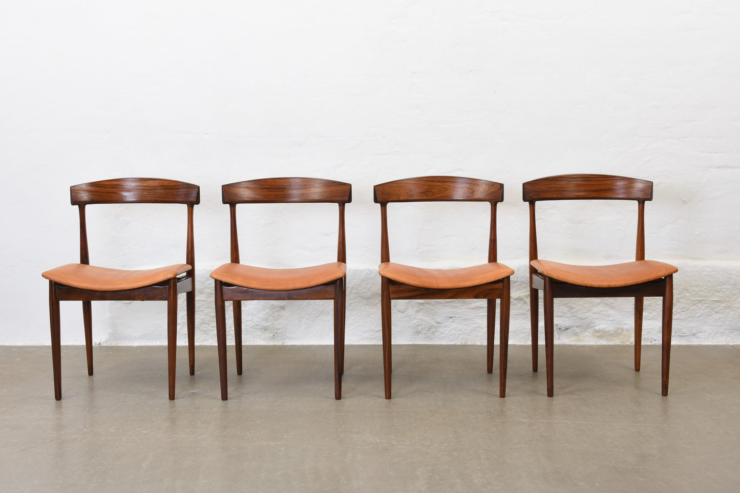 Set of four 1960s rosewood + leather dining chairs