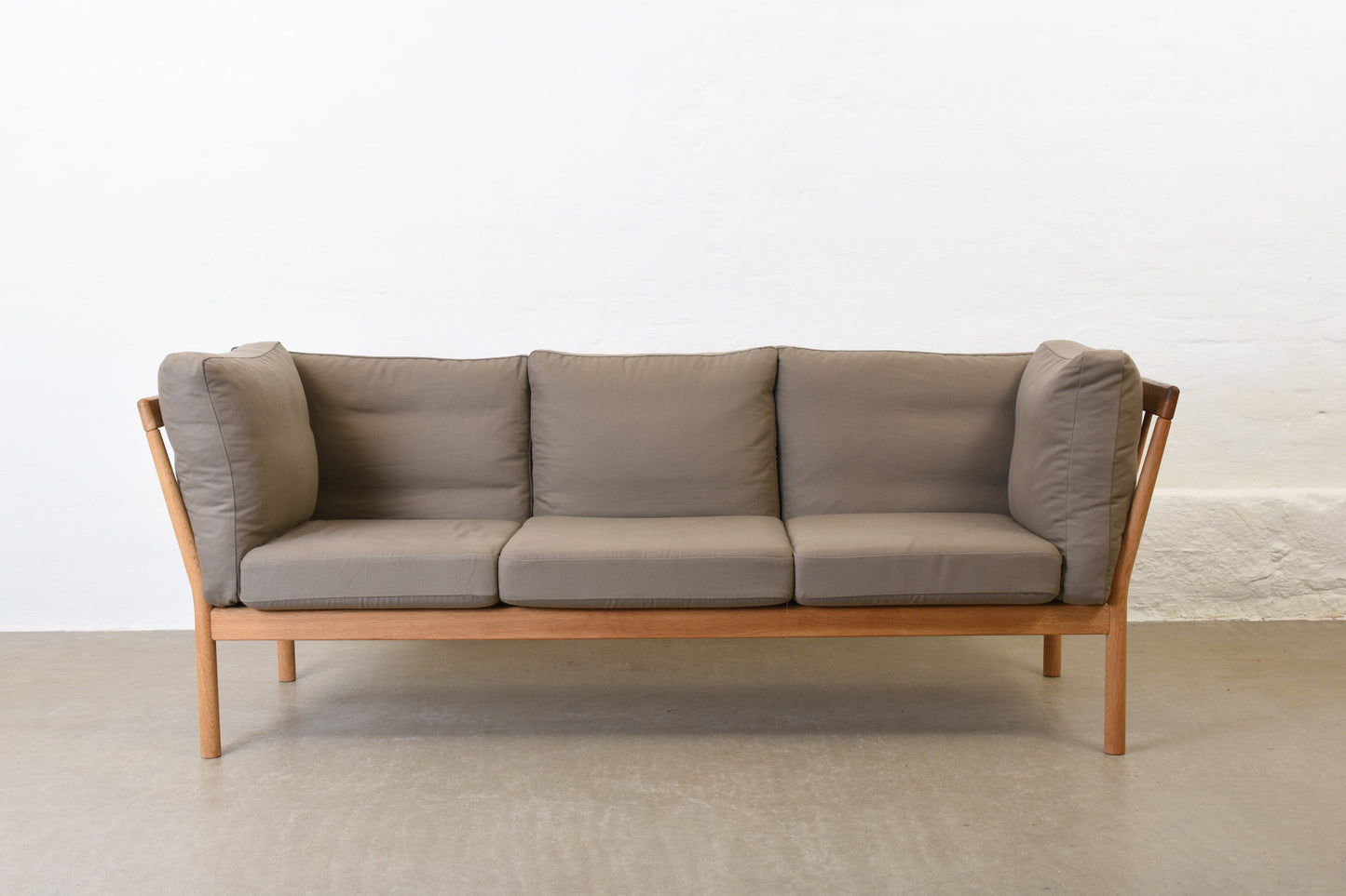 Newly reupholstered: 1980s oak three seater by Finn Østergaard