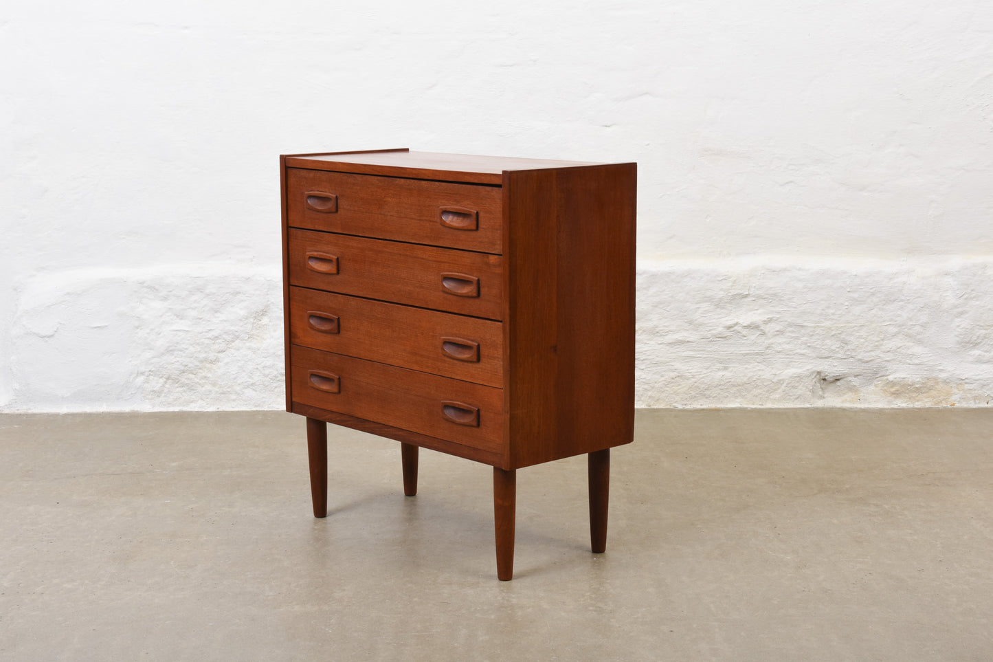 Low teak chest with inset handles