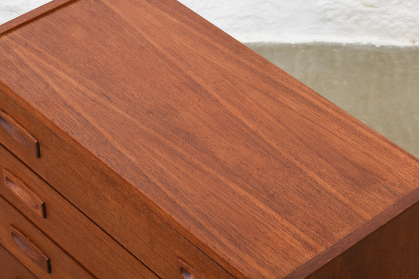 Low teak chest with inset handles