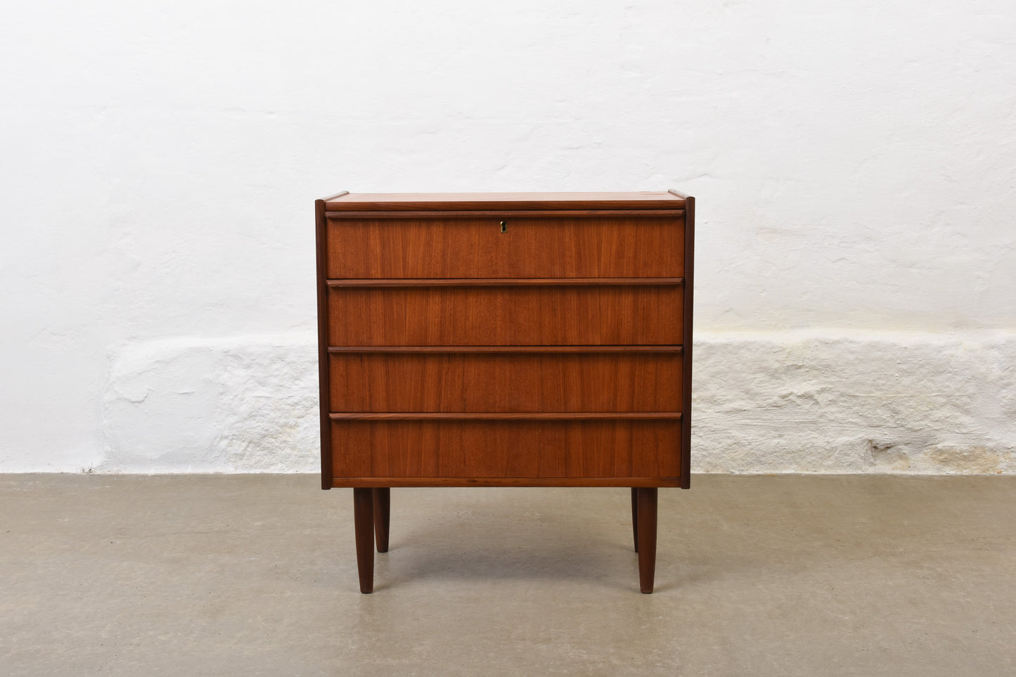 Low teak chest with lipped handles