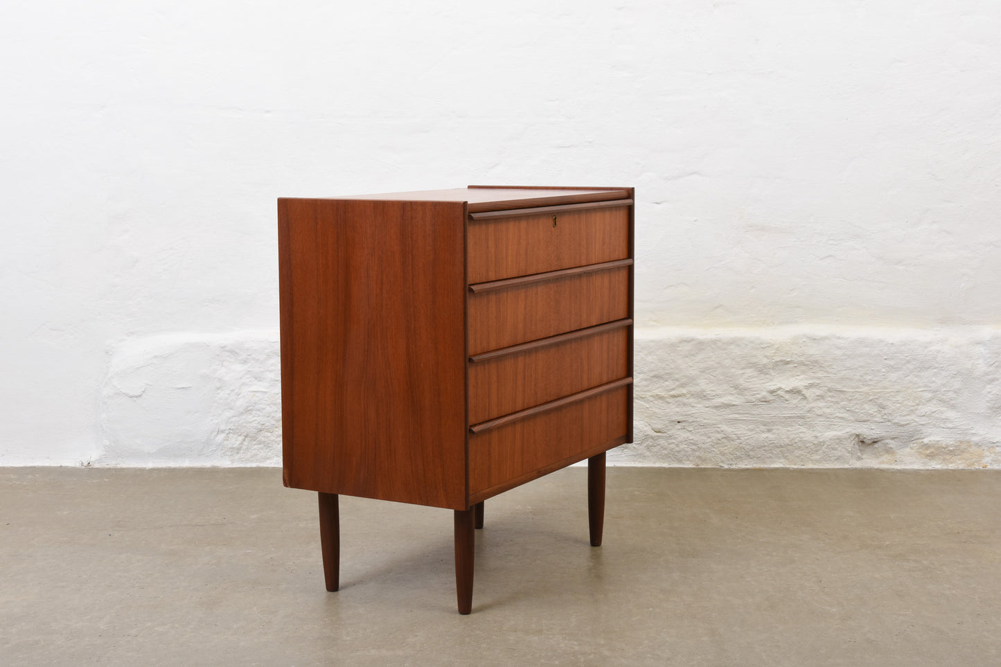 Low teak chest with lipped handles