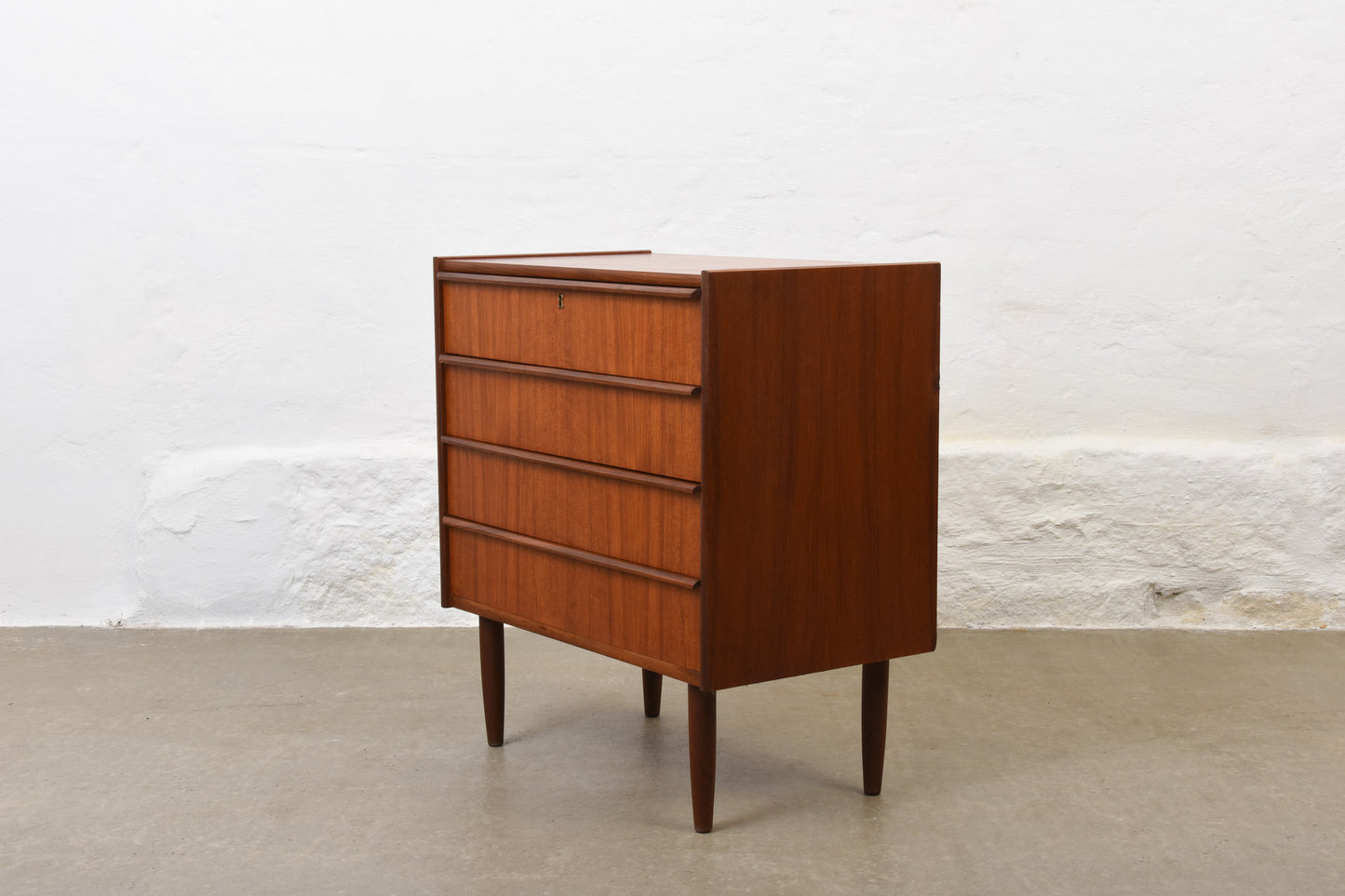 Low teak chest with lipped handles