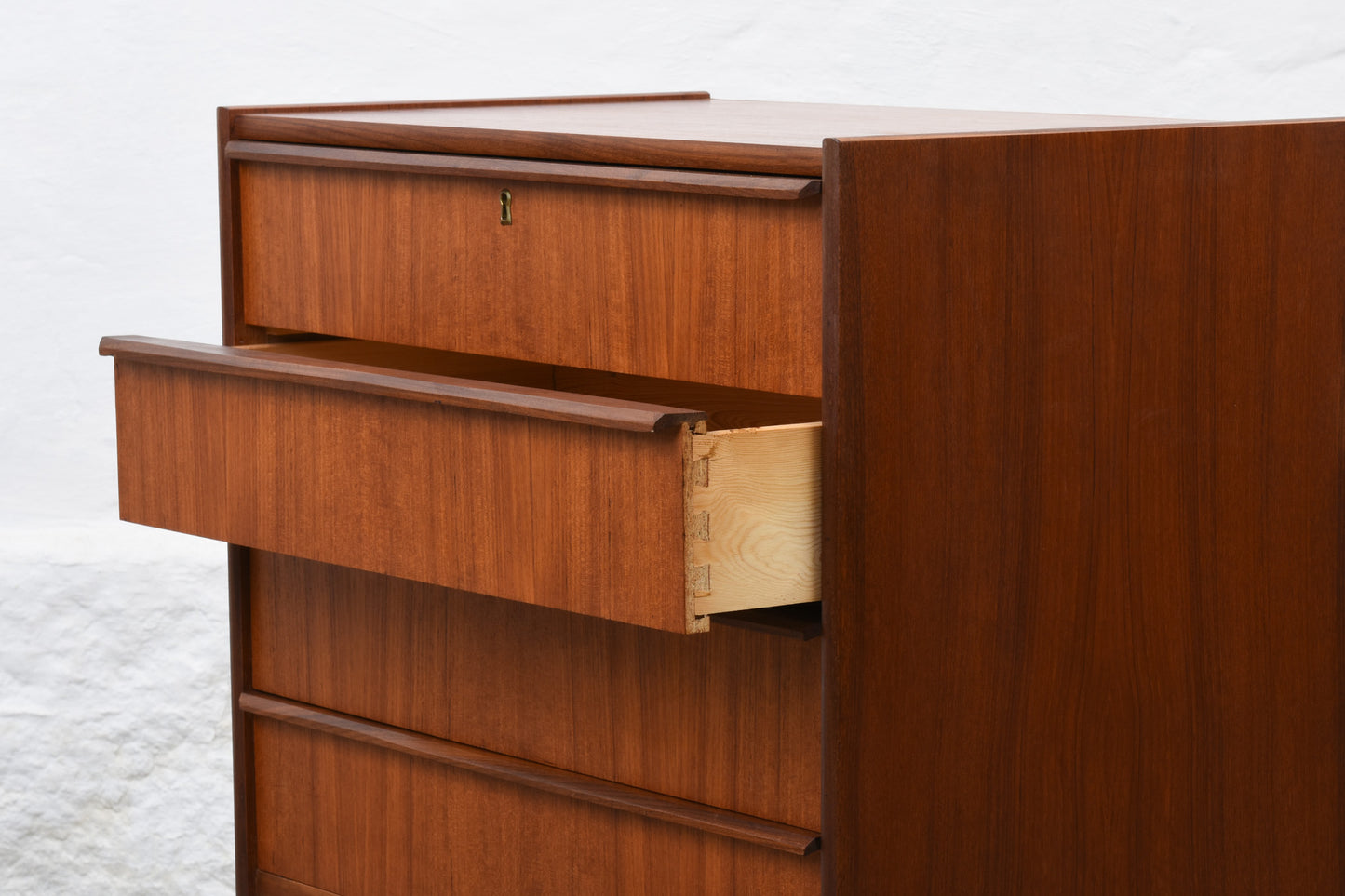 Low teak chest with lipped handles