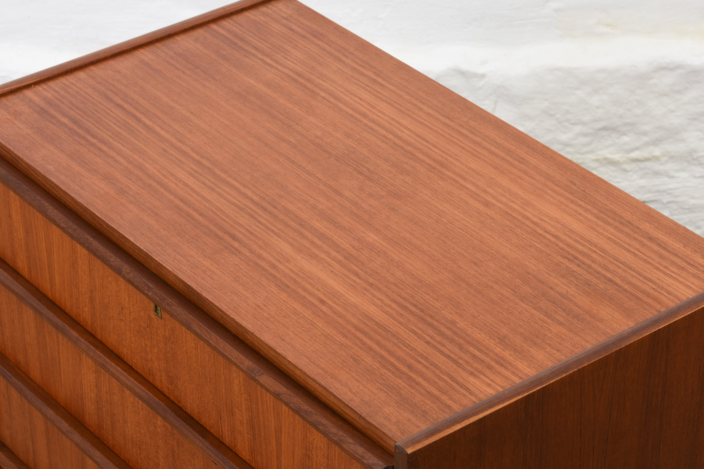 Low teak chest with lipped handles