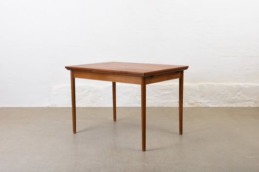 1950s extending teak dining table on beech base