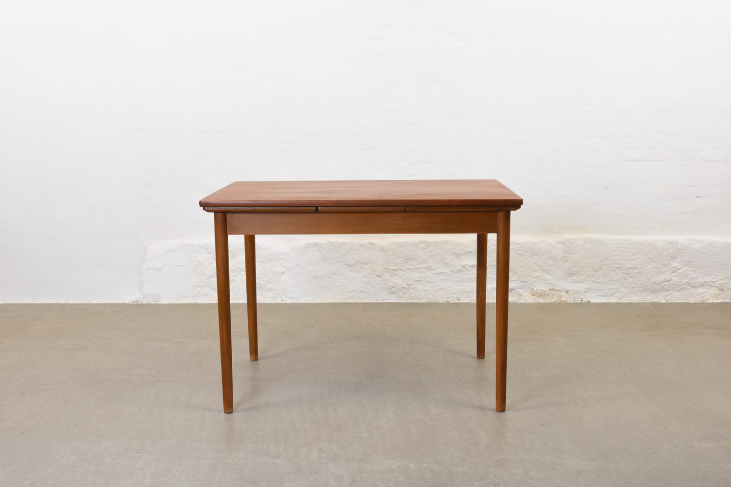 1950s extending teak dining table on beech base