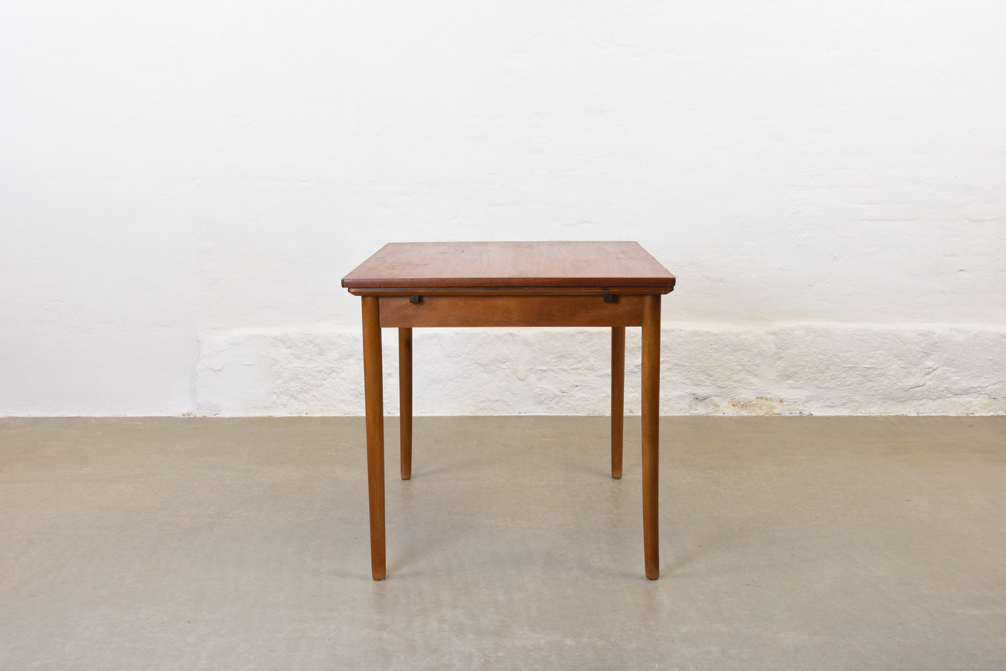 1950s extending teak dining table on beech base