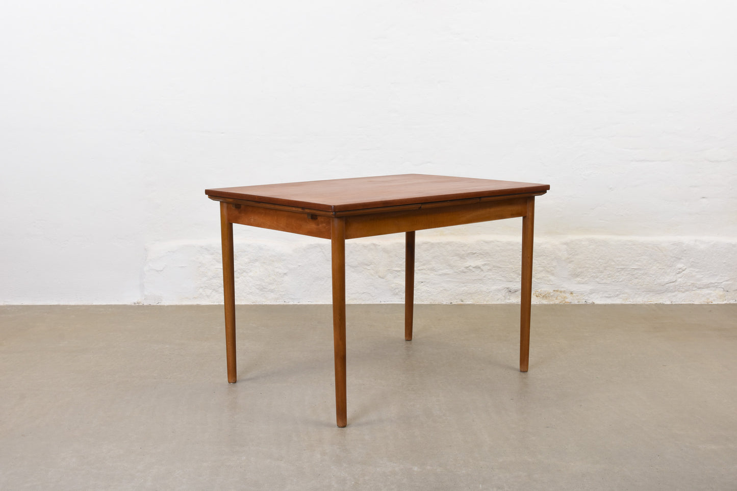 1950s extending teak dining table on beech base