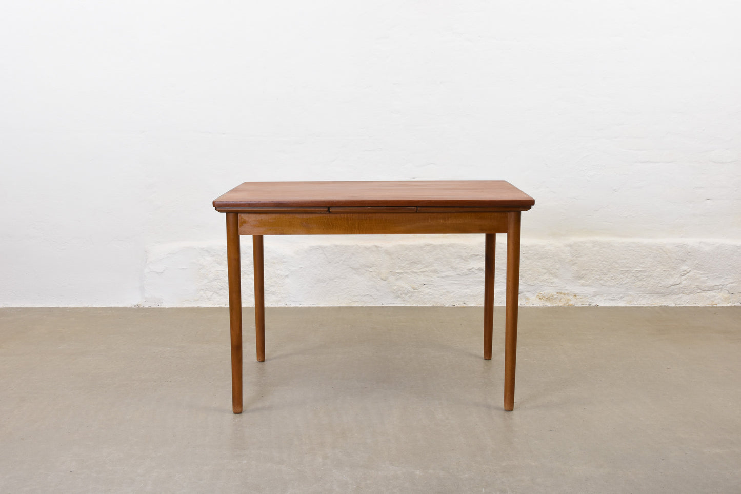 1950s extending teak dining table on beech base