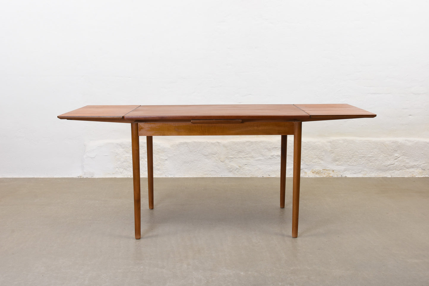 1950s extending teak dining table on beech base