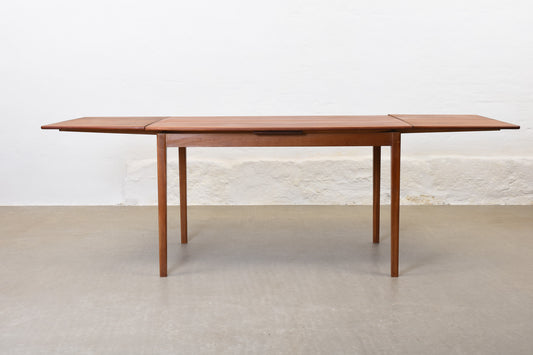 1960s boat-shaped dining table in teak