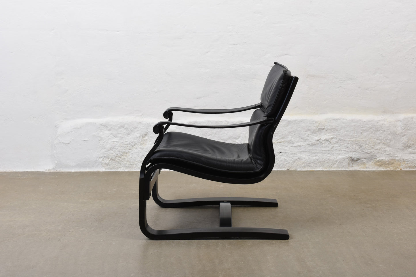 Two available: 1980s leather + beech loungers by Åke Fribytter