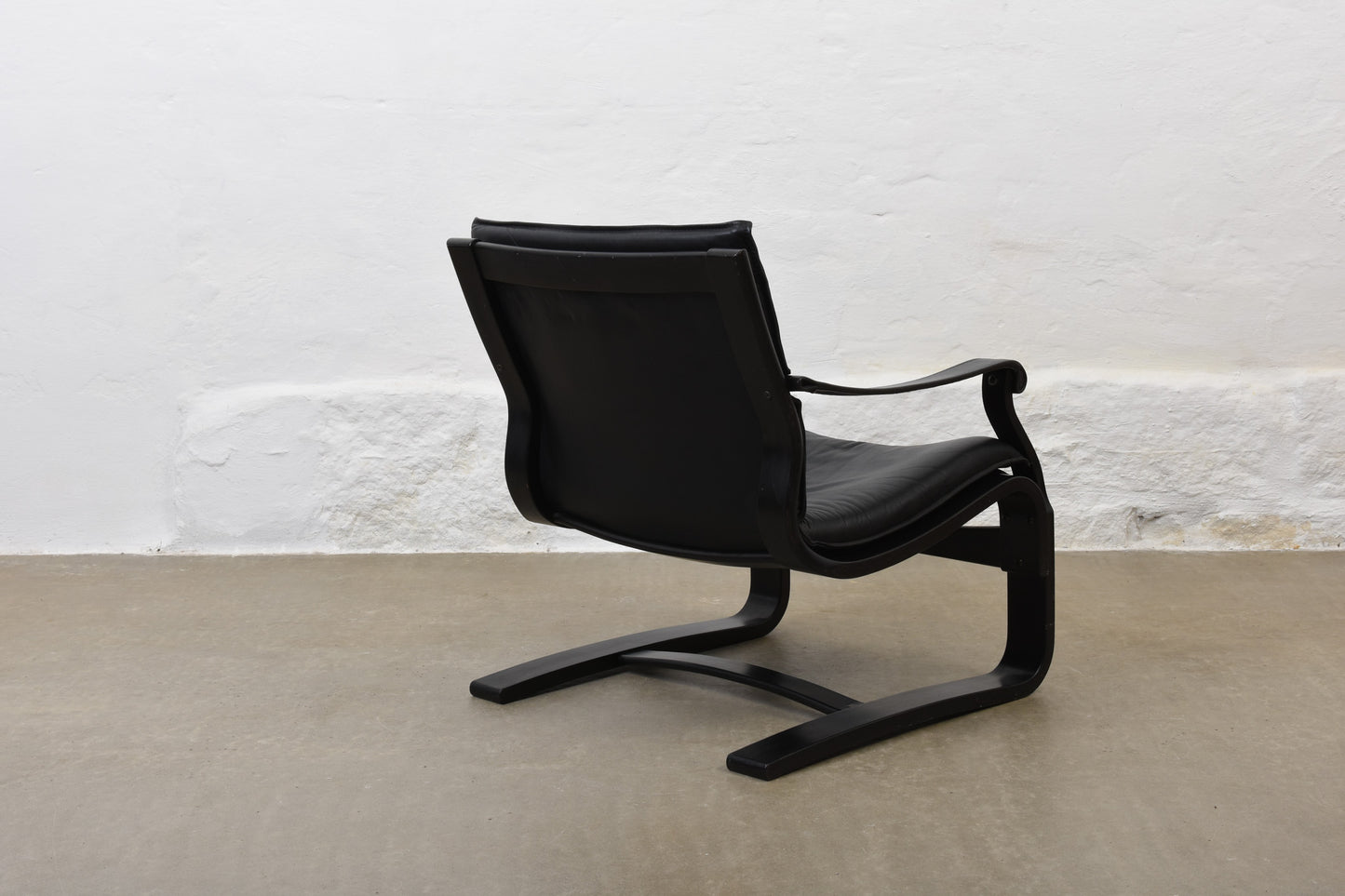 Two available: 1980s leather + beech loungers by Åke Fribytter