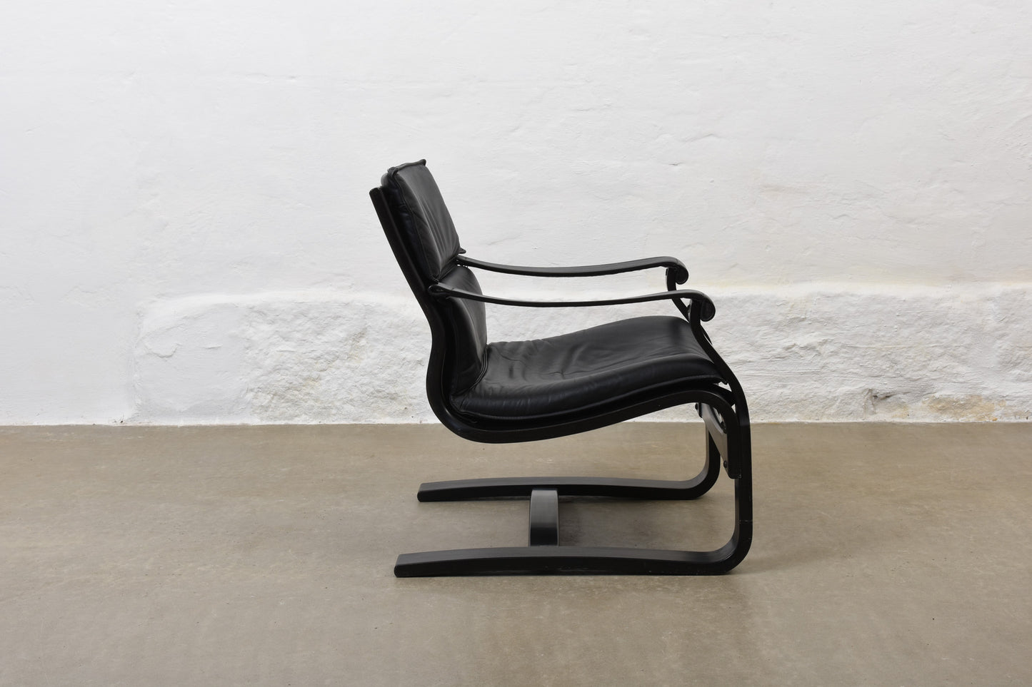 Two available: 1980s leather + beech loungers by Åke Fribytter