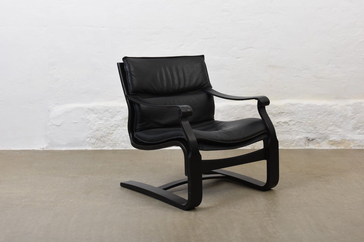 Two available: 1980s leather + beech loungers by Åke Fribytter