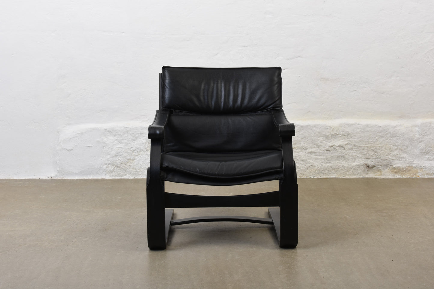 Two available: 1980s leather + beech loungers by Åke Fribytter