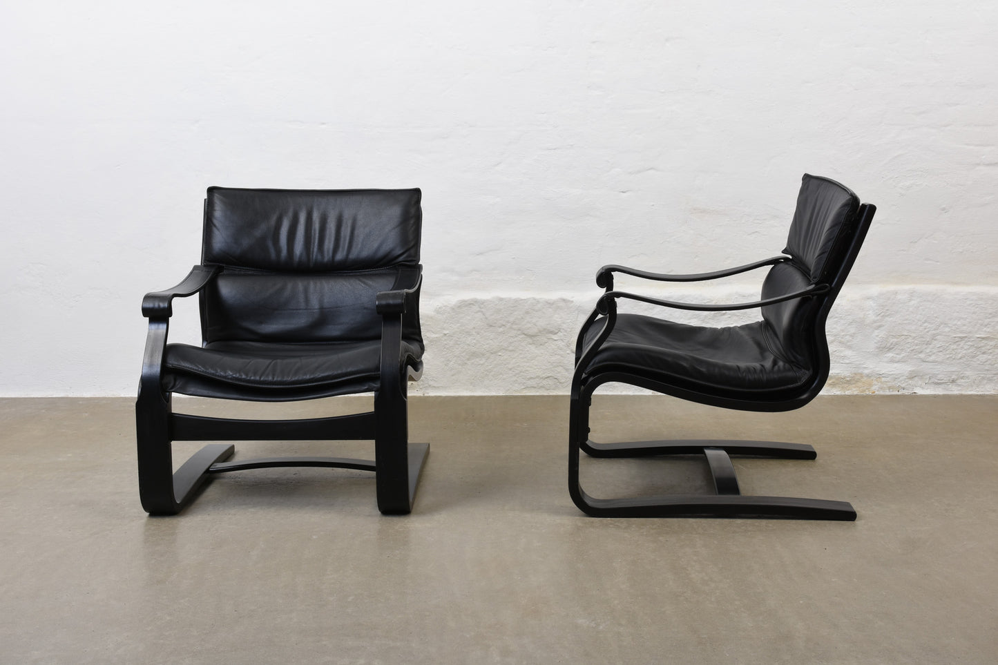 Two available: 1980s leather + beech loungers by Åke Fribytter