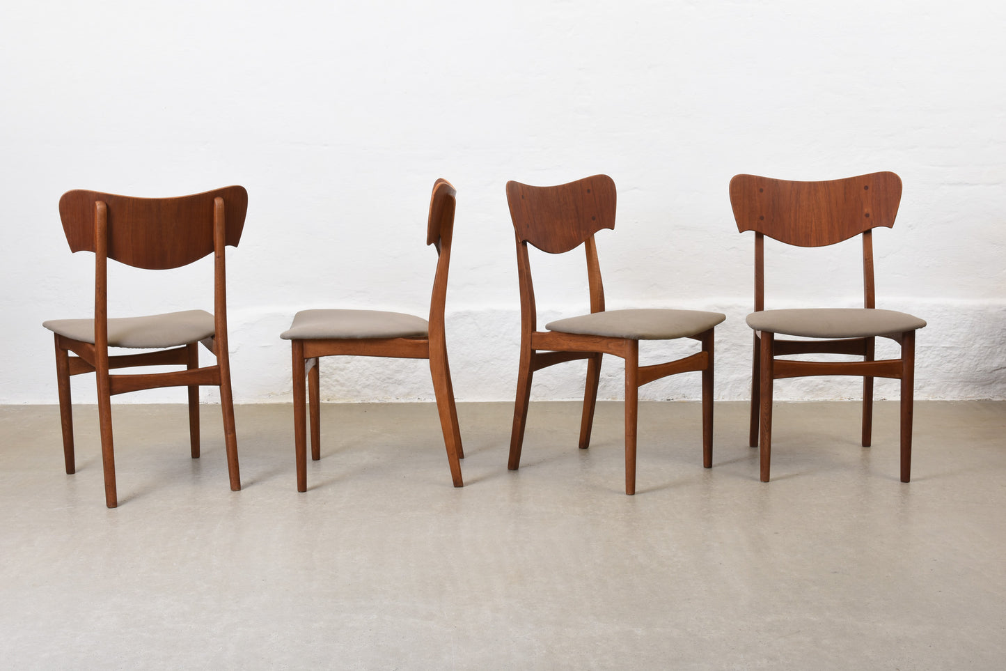 Newly reupholstered: Set of four 1950s teak + oak chairs