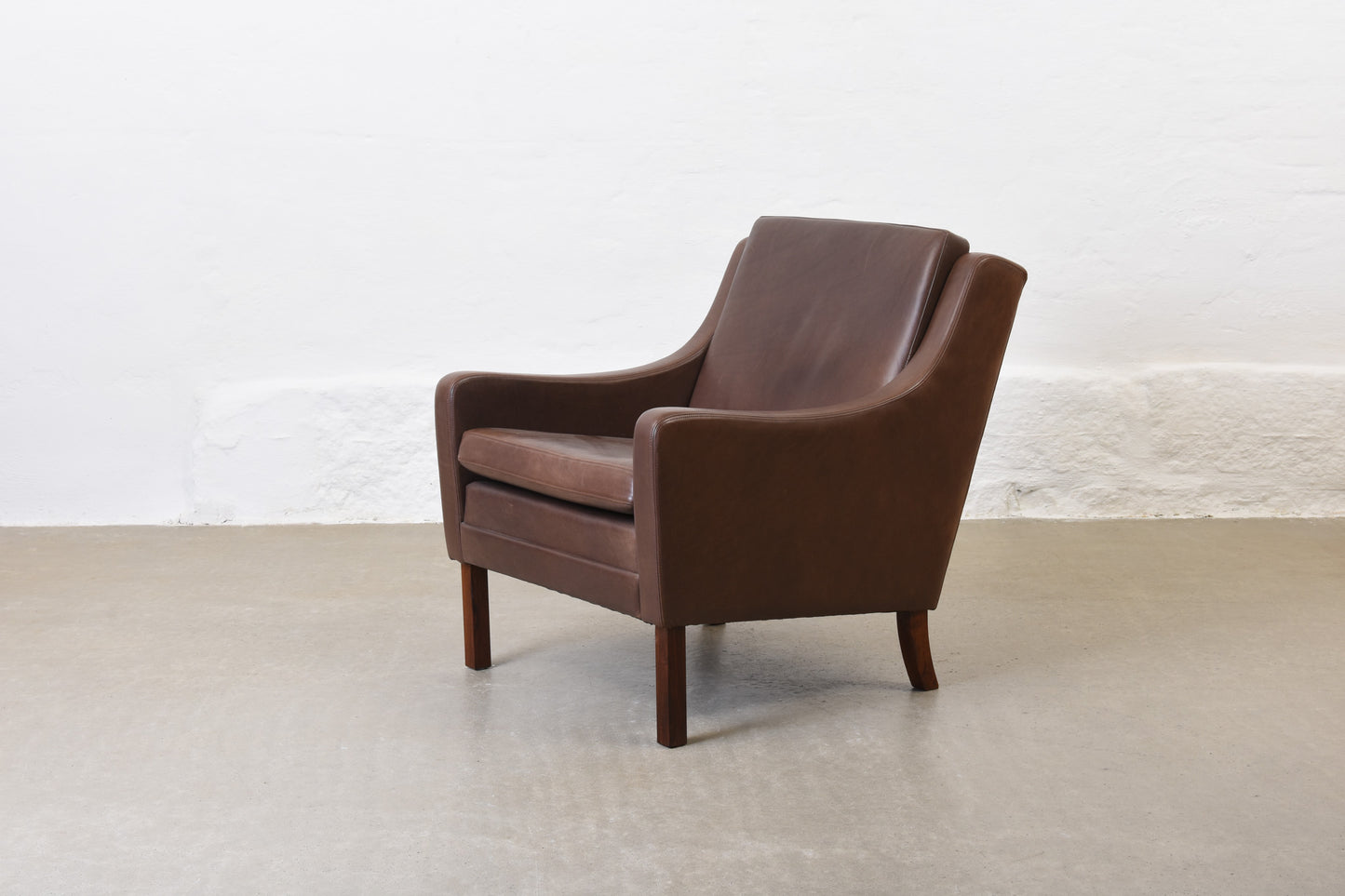 1960s leather club chair on rosewood legs