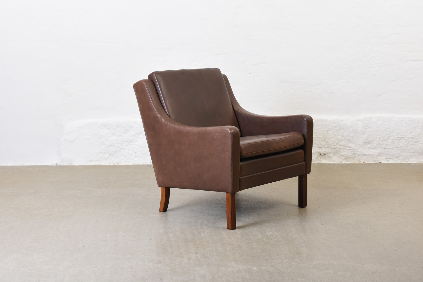 1960s leather club chair on rosewood legs