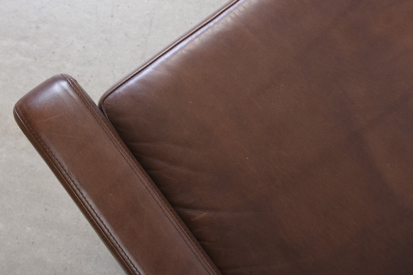 1960s leather club chair on rosewood legs