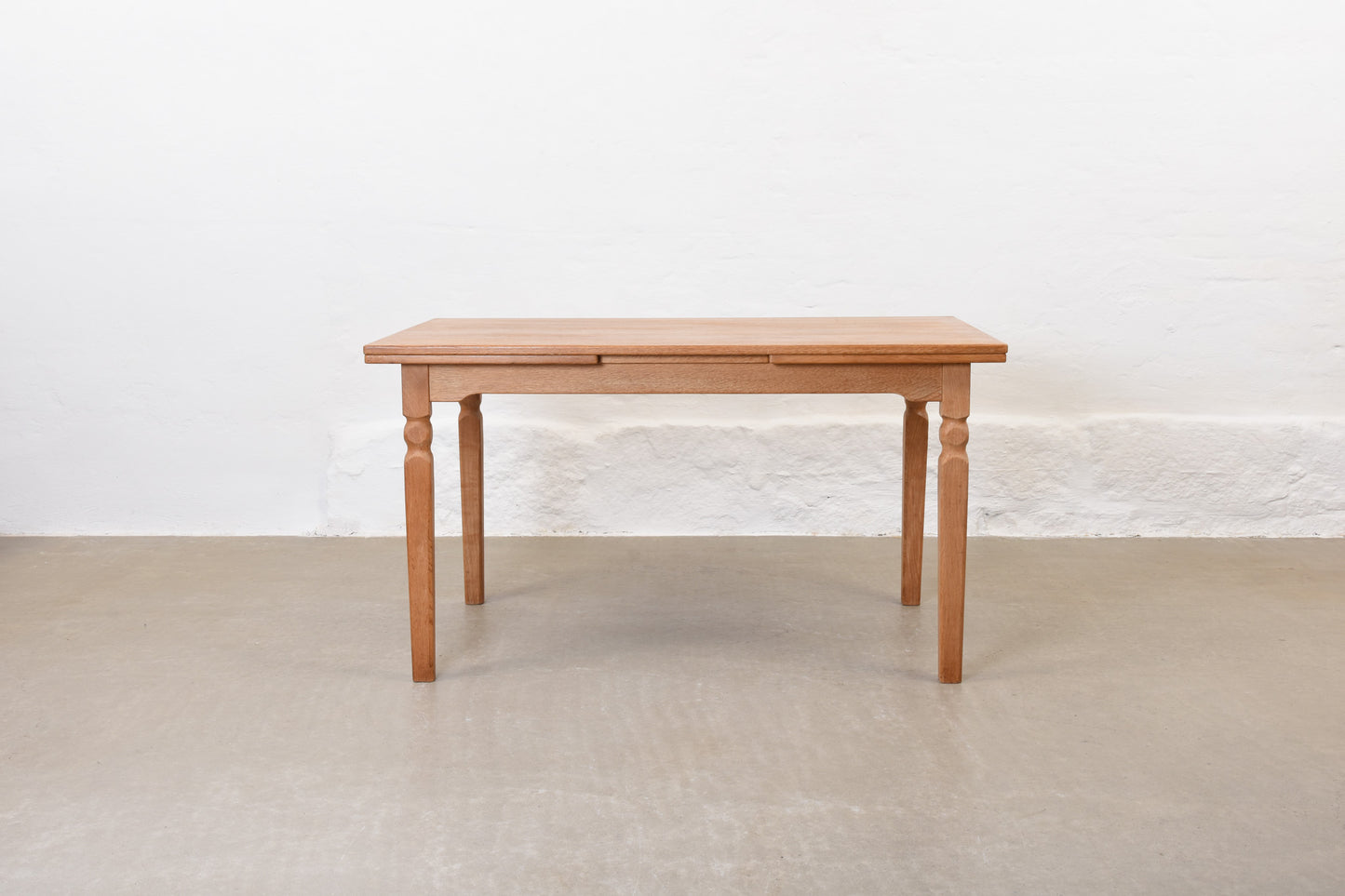 1970s extending dining table in oak by Henning Kjærnulf