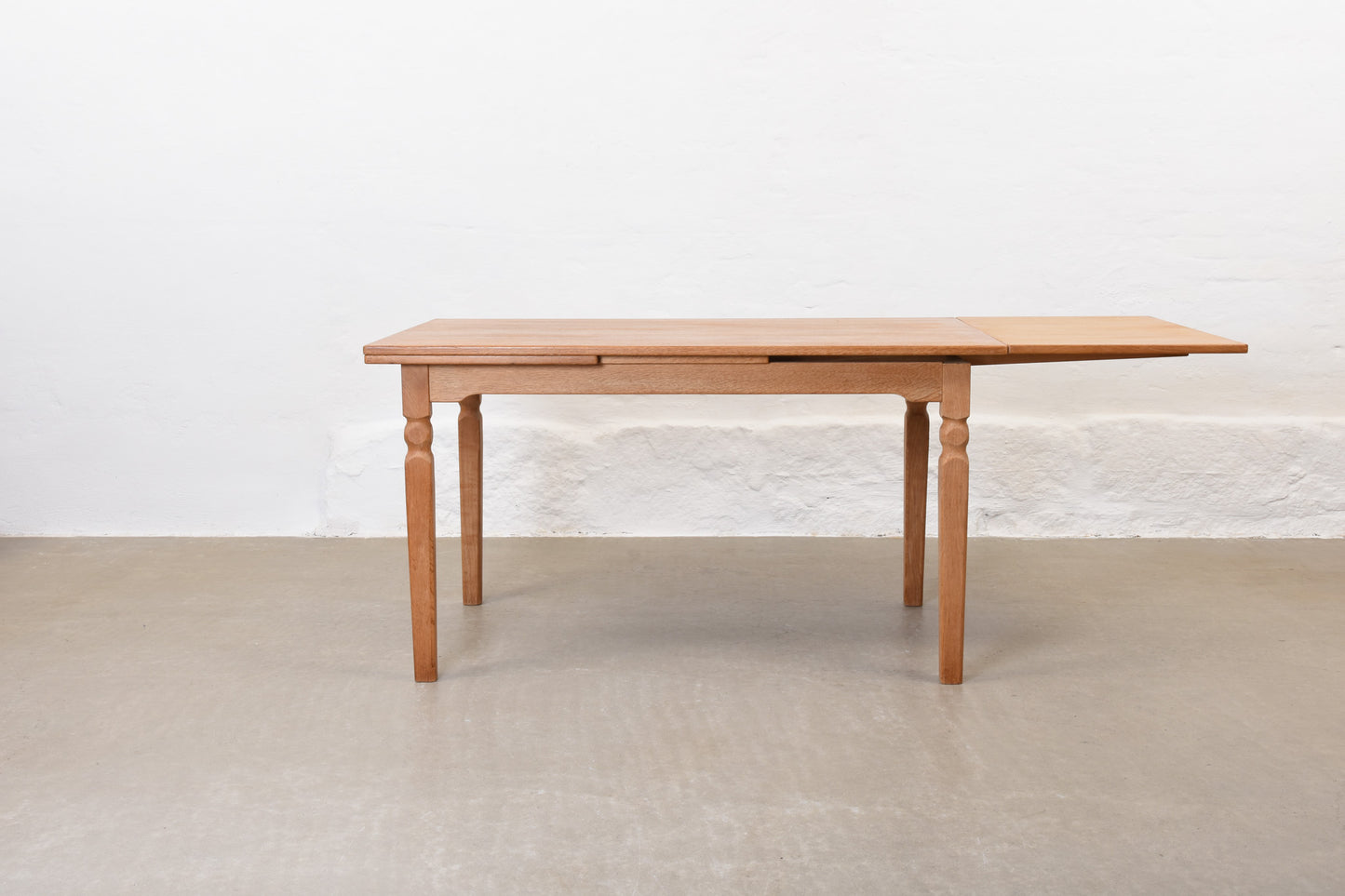 1970s extending dining table in oak by Henning Kjærnulf