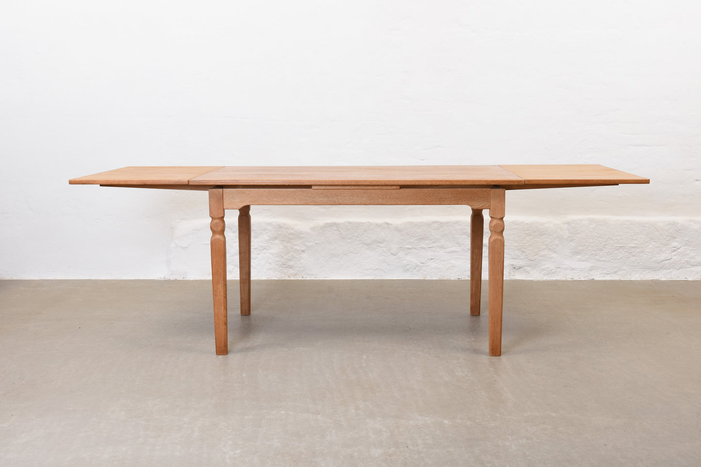 1970s extending dining table in oak by Henning Kjærnulf