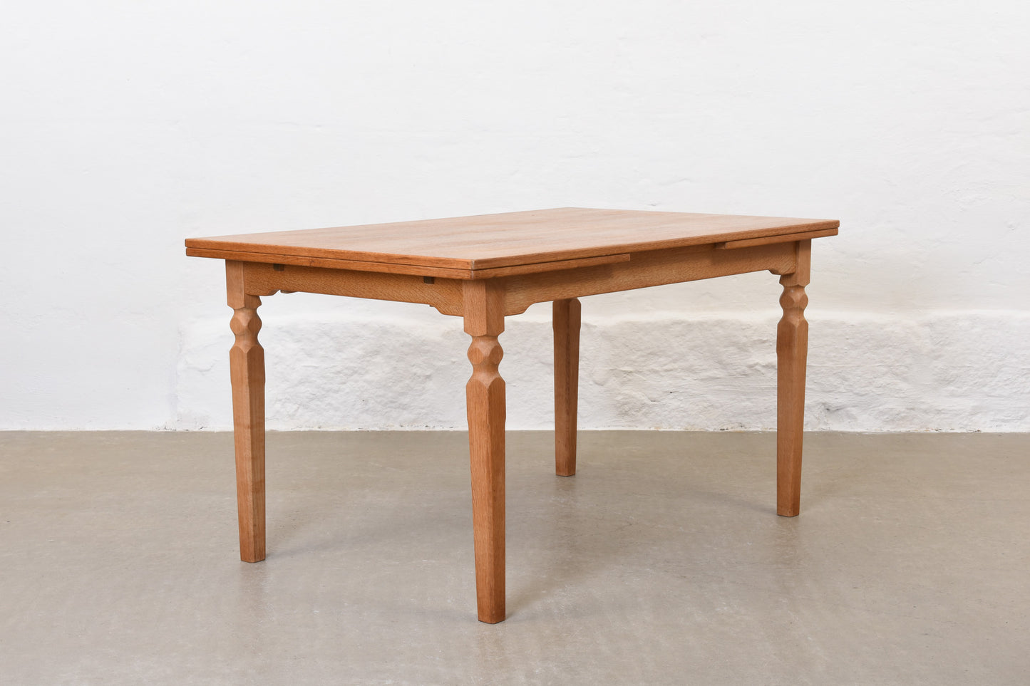 1970s extending dining table in oak by Henning Kjærnulf