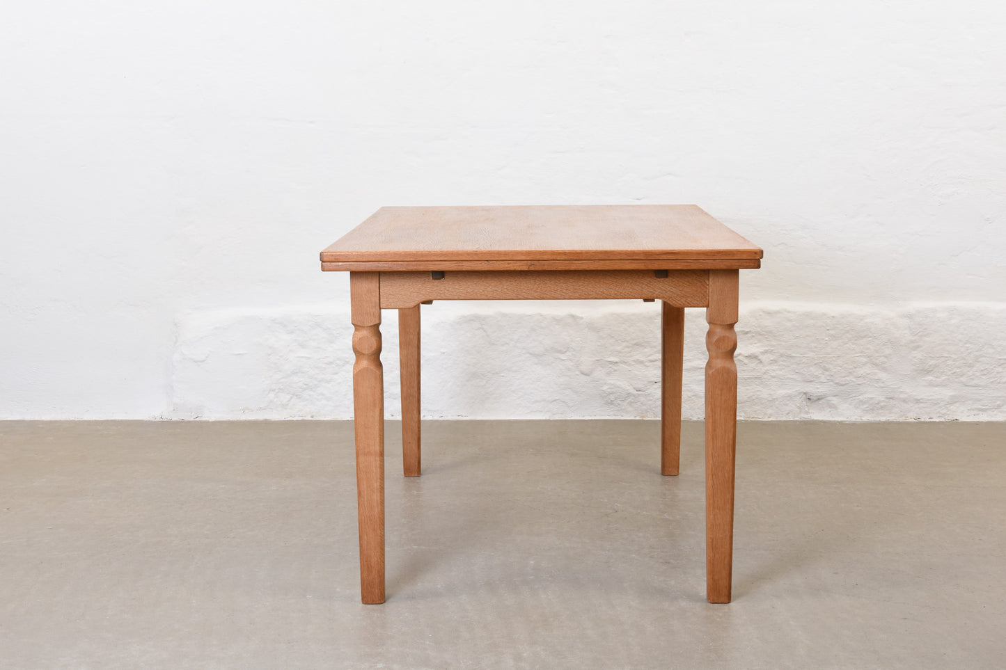 1970s extending dining table in oak by Henning Kjærnulf