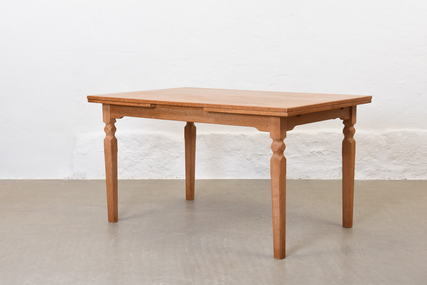 1970s extending dining table in oak by Henning Kjærnulf