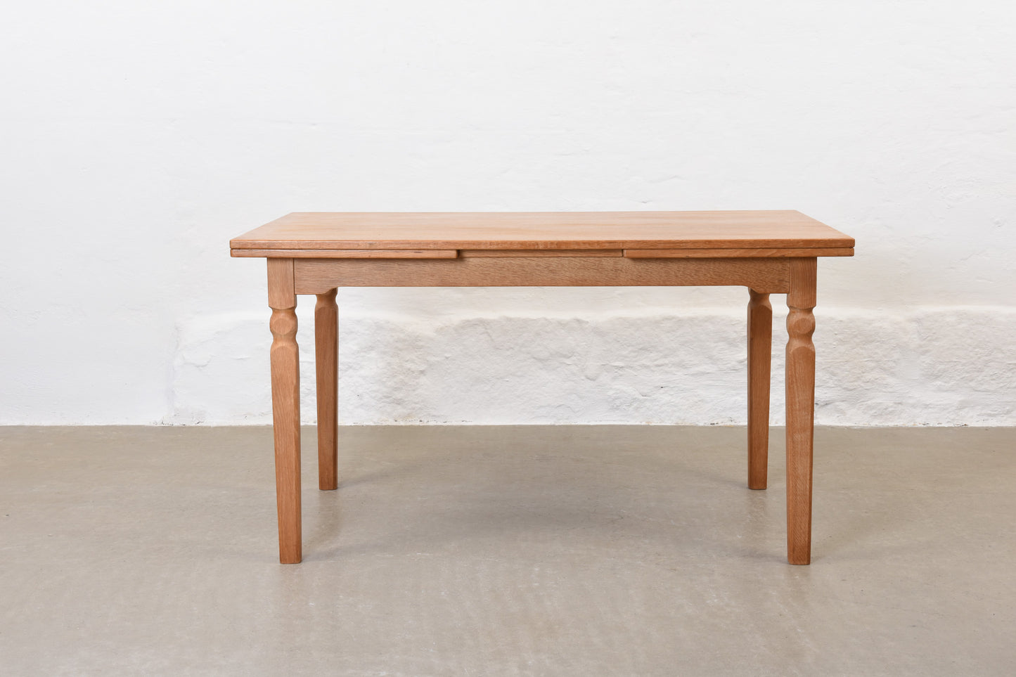 1970s extending dining table in oak by Henning Kjærnulf