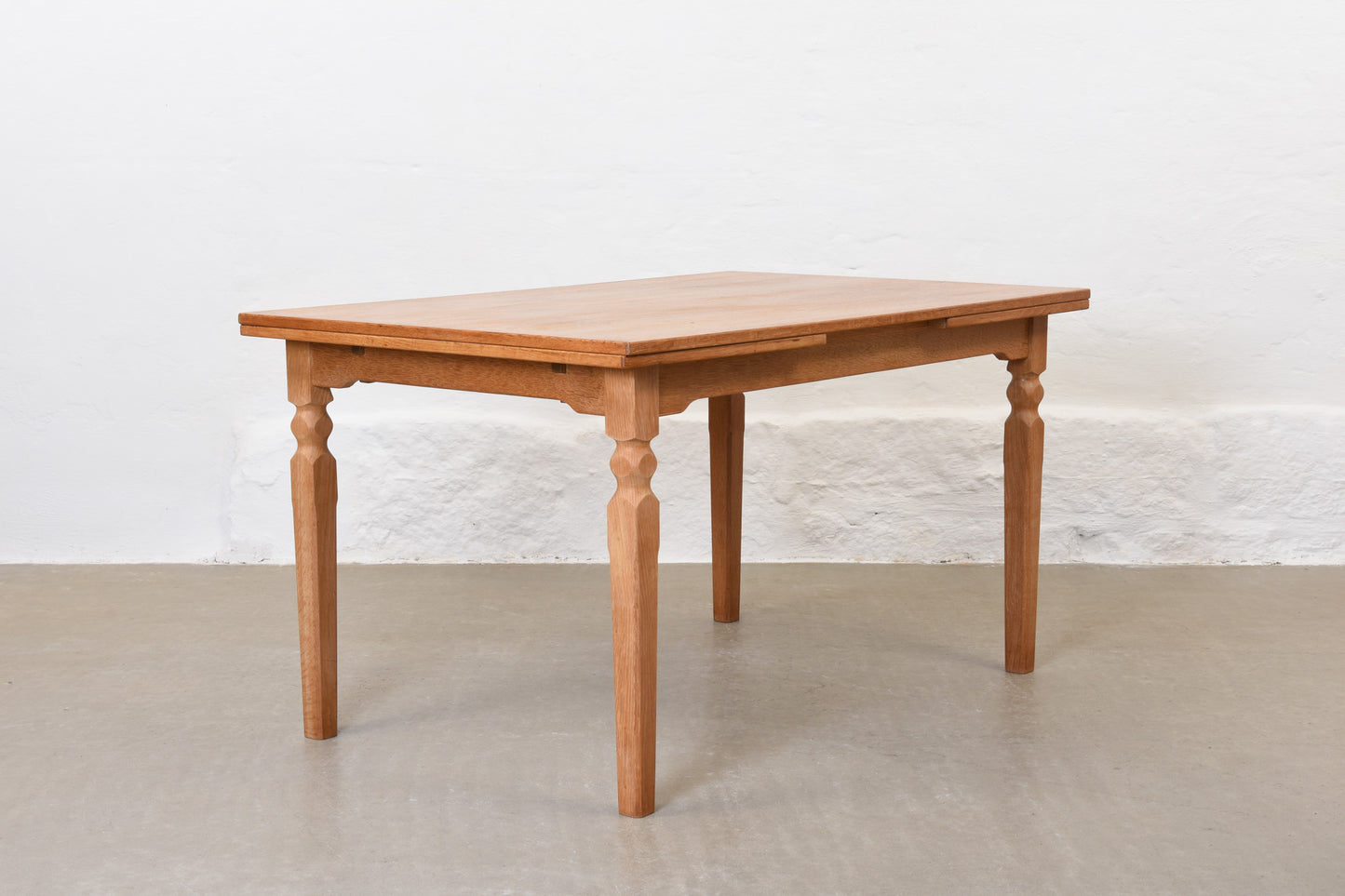 1970s extending dining table in oak by Henning Kjærnulf