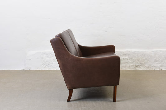 1960s two seat leather sofa on rosewood legs