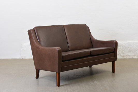 1960s two seat leather sofa on rosewood legs