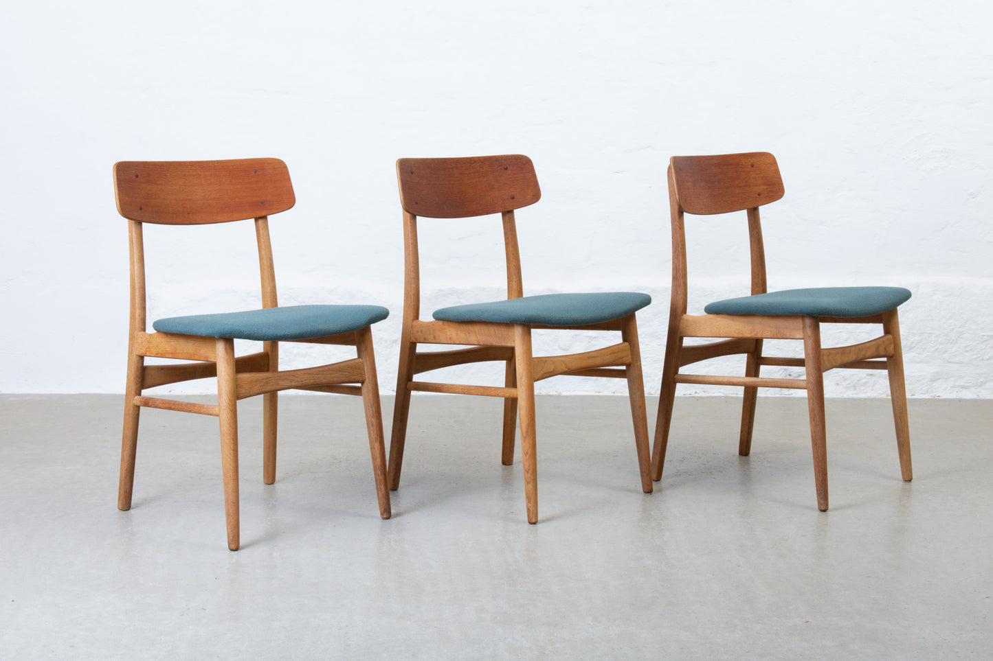 Newly reupholstered: Set of 1960s teak + oak dining chairs