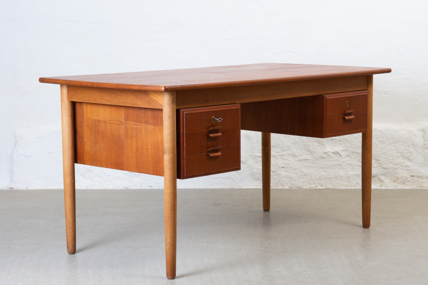 1960s twin pedestal desk in teak + oak
