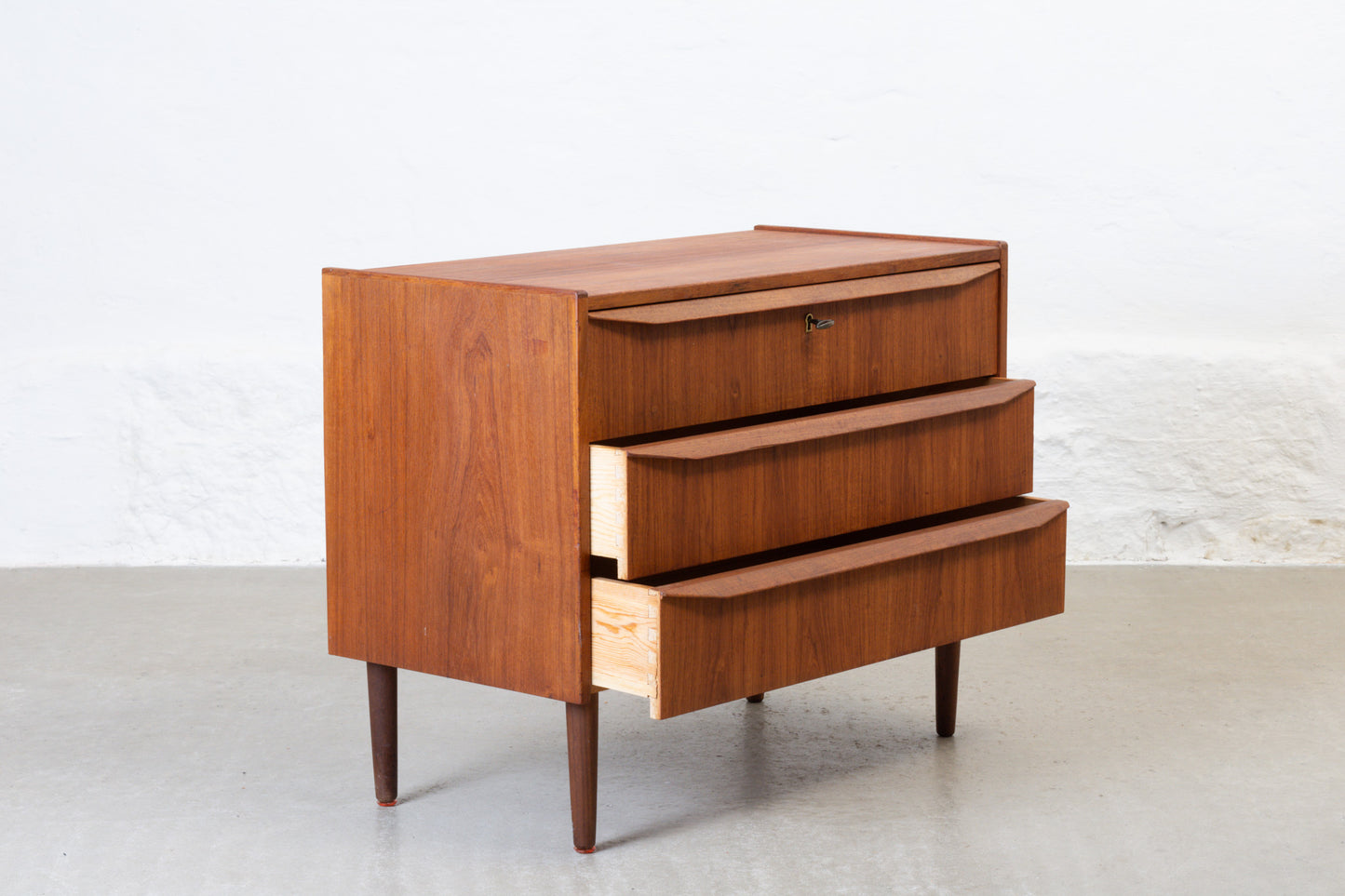 1960s low teak chest of three drawers