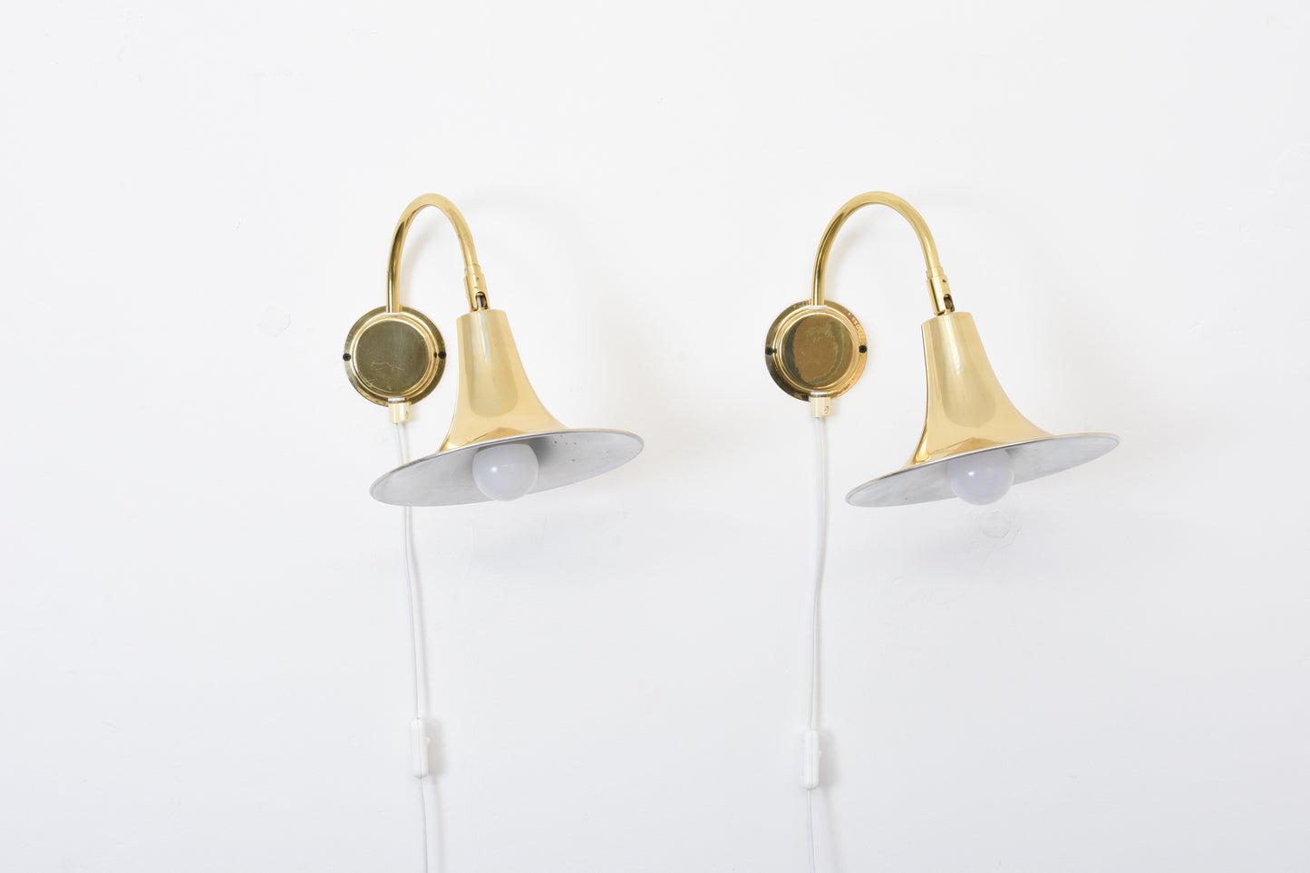 Two available: 1970s brass wall lights by Börje Claes