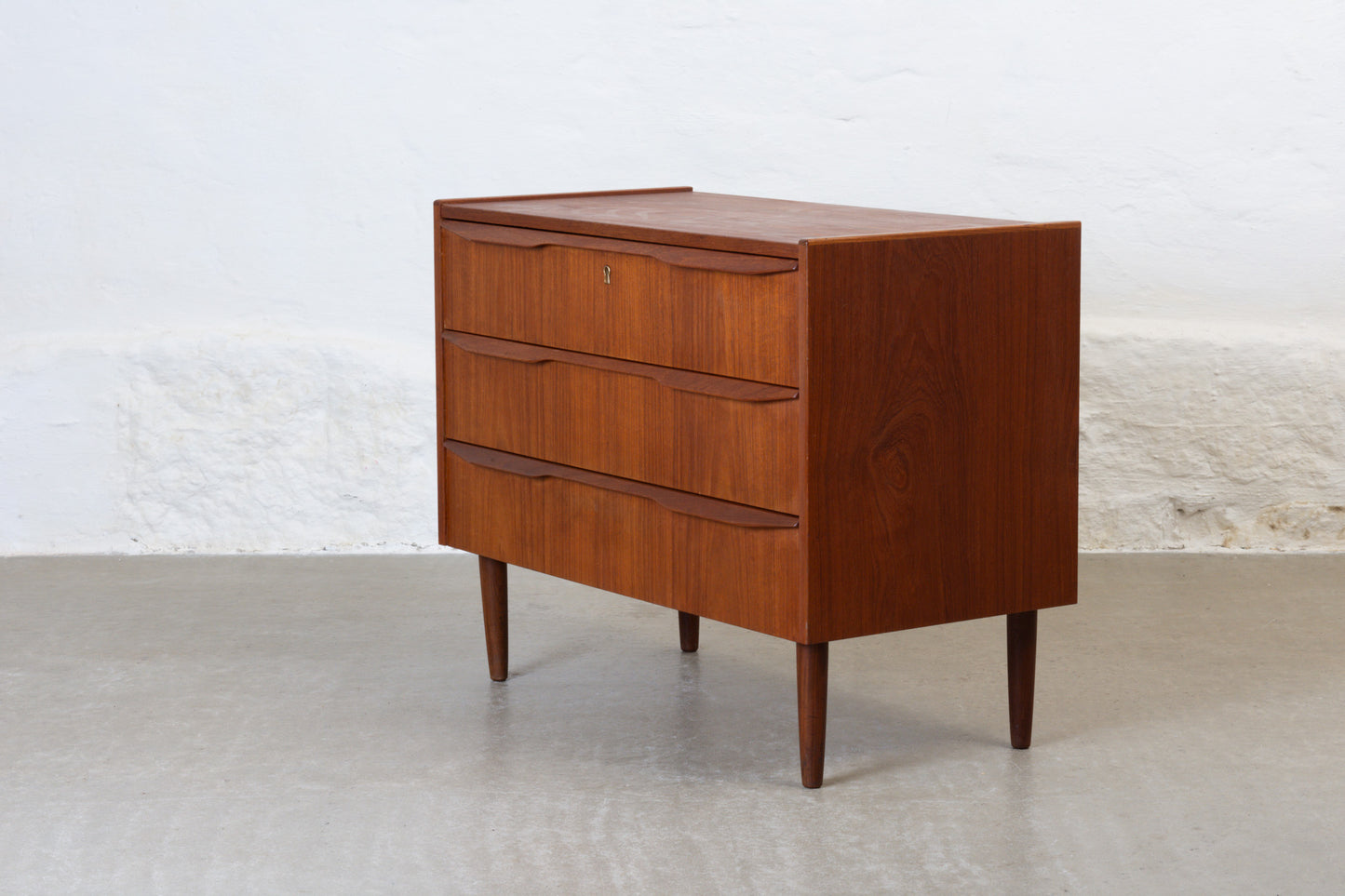 1960s low teak chest with lipped handles