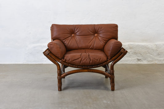 Two available: 1970s bamboo + leather lounge chairs