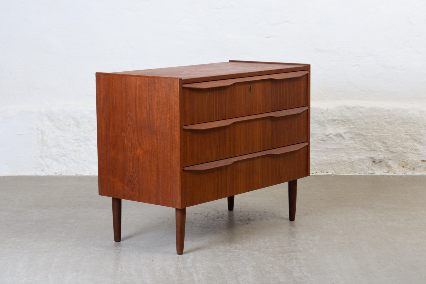 1960s low teak chest with lipped handles