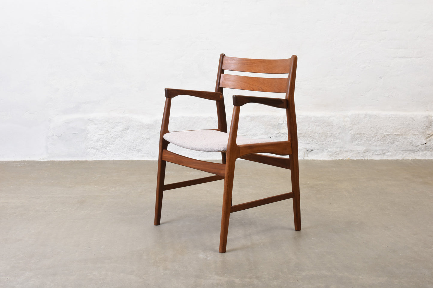 Newly upholstered: 1950s teak armchair